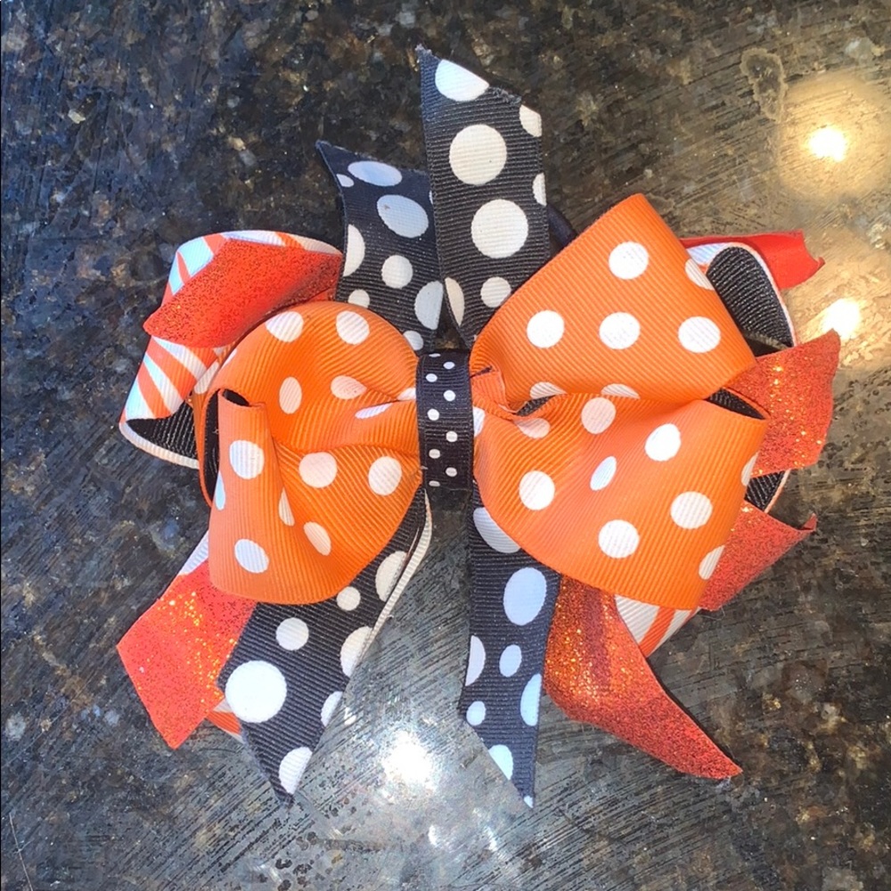 orange, black and white bow